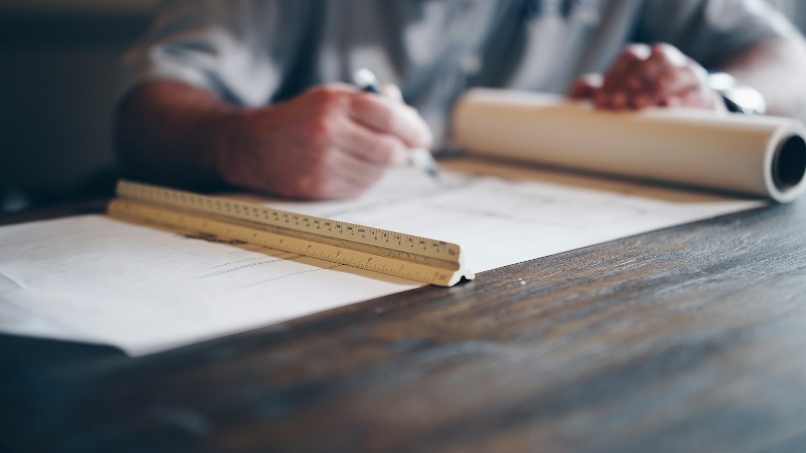 Blueprints and ruler on a desk