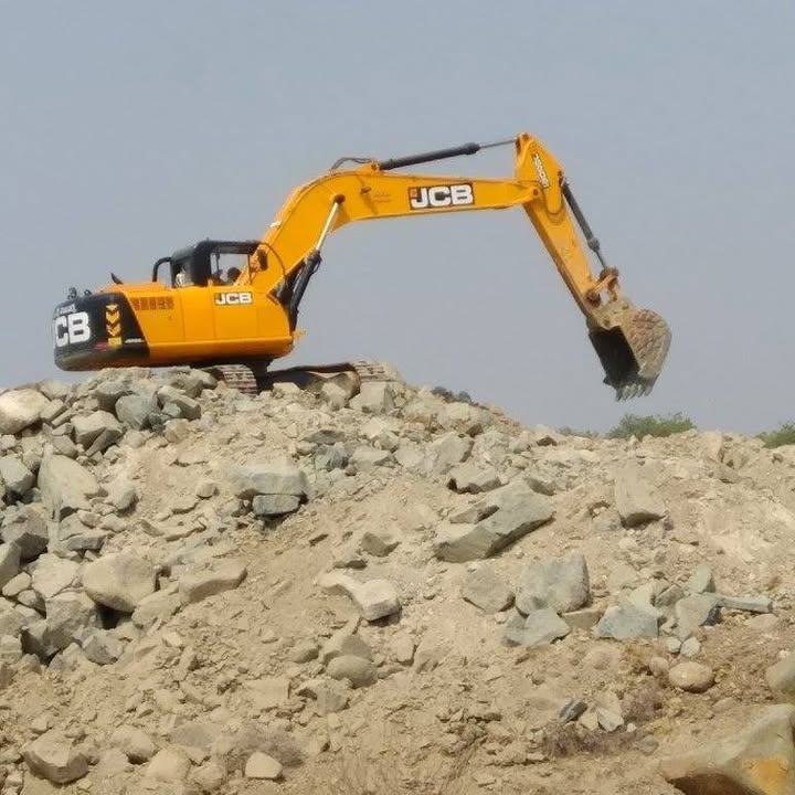 JCB excavator working on a rock earthwork site